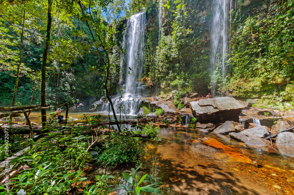 Rosario Waterfall. This waterfall is compared to an oasis of crystalline waters with natural pools, with 13 meter in height and the green fields make this tourist hot spot. Pirenópolis. Brazil, 2020