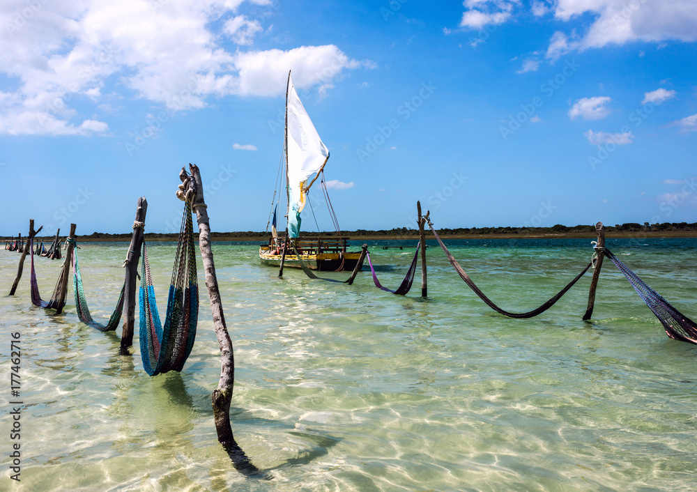 Sail boat and hammocks at the Paradise Lake, Jericoacoara, Brazil